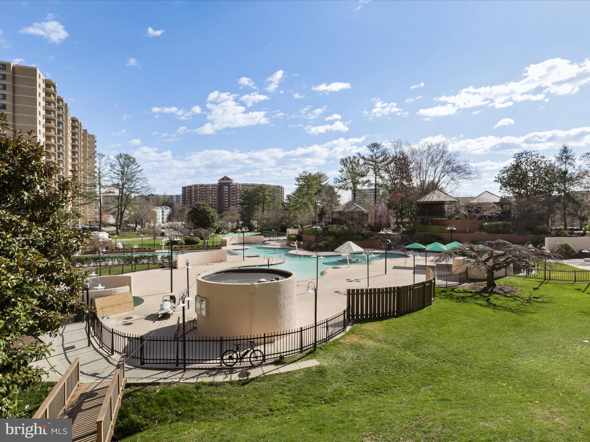 205 Yoakum Parkway, Unit 1020 Alexandria, VA 22304 - Photo 40 of 62 a building outdoor space with patio furniture and a garden