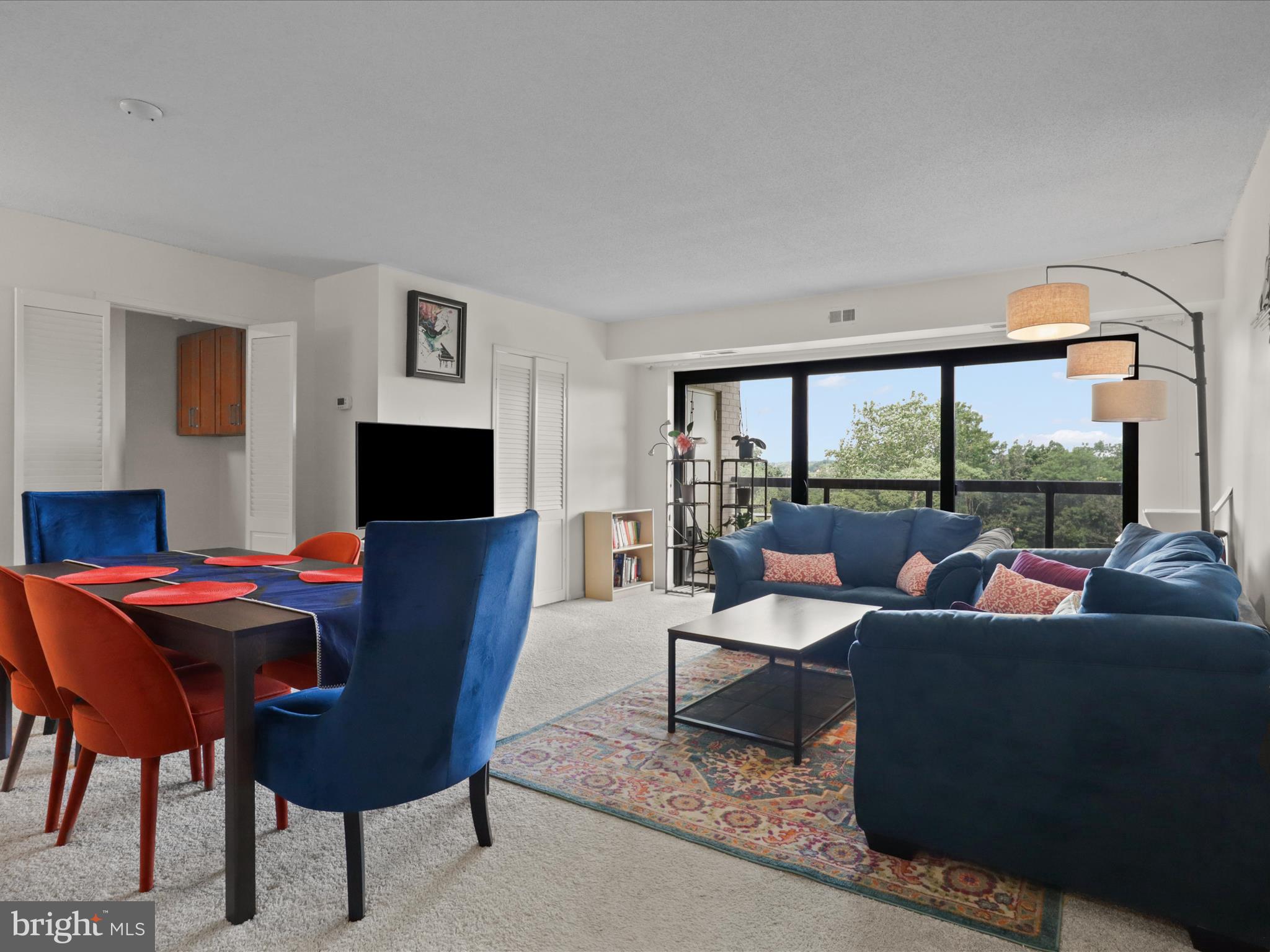 205 Yoakum Parkway, Unit 1020 Alexandria, VA 22304 - Photo 6 of 62 a living room with furniture and a flat screen tv