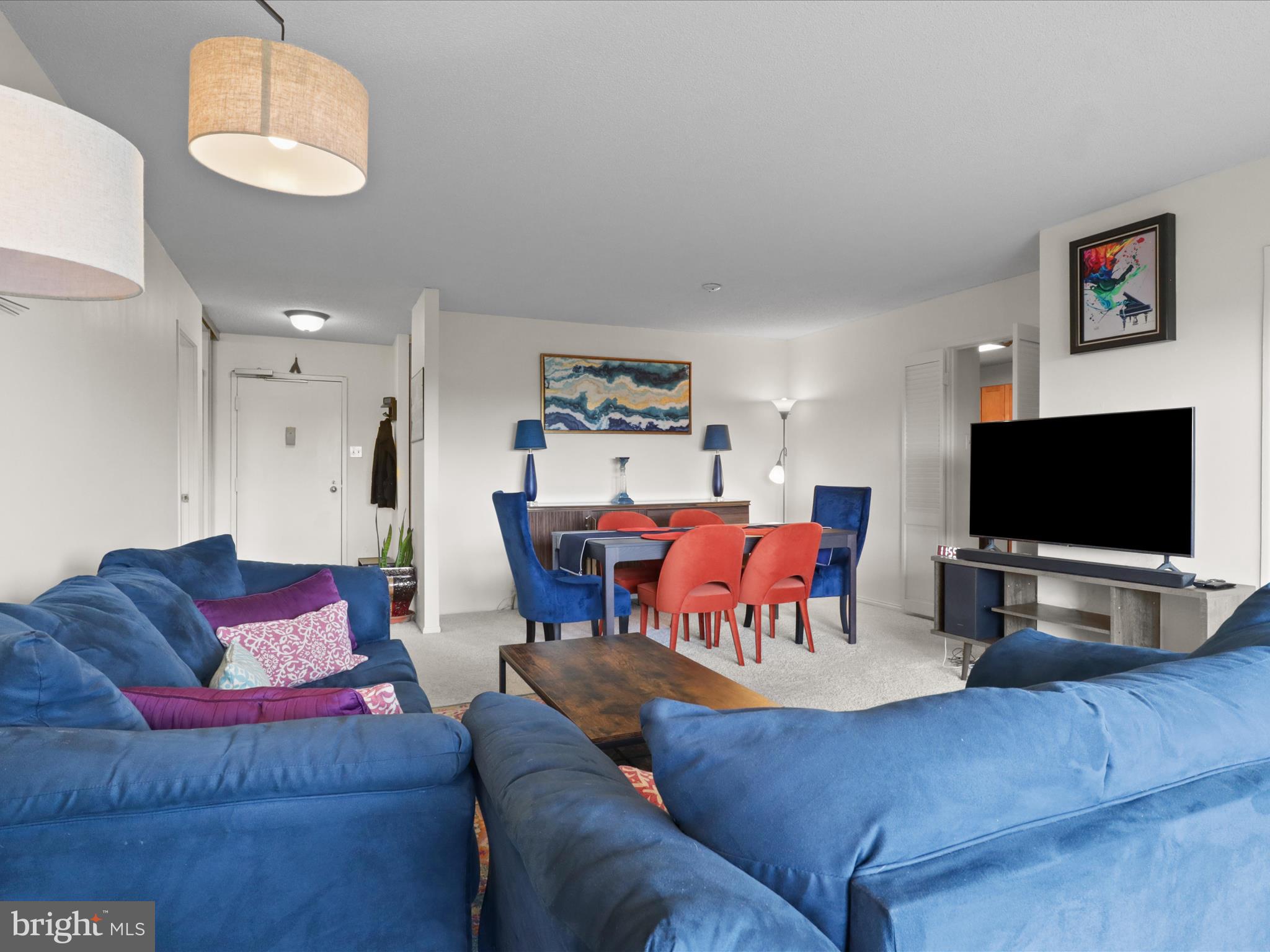 205 Yoakum Parkway, Unit 1020 Alexandria, VA 22304 - Photo 62 of 62 a living room with furniture and a flat screen tv