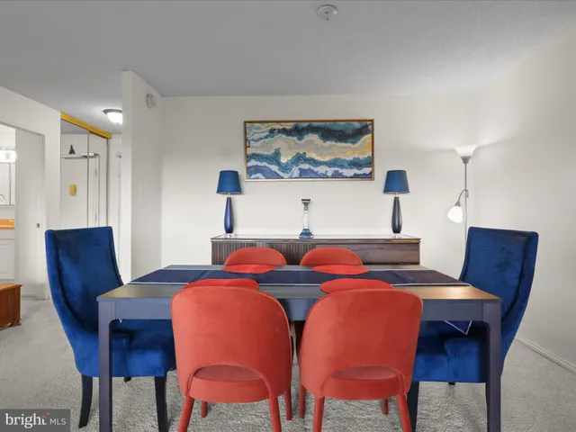 a bedroom with a bed and a chair