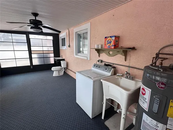a kitchen with cabinets and refrigerator