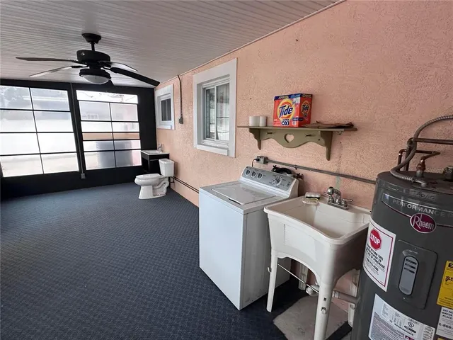 a kitchen with cabinets and refrigerator