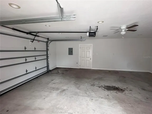 a view of a house with backyard and kitchen