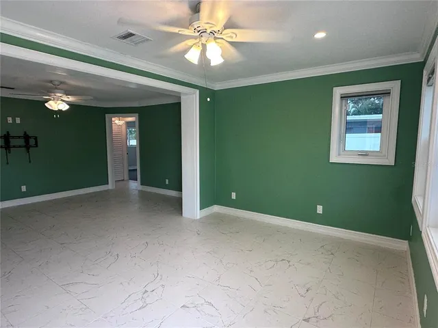 a view of an empty room with a window