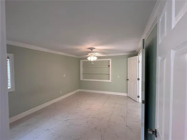 a view of an empty room with a window