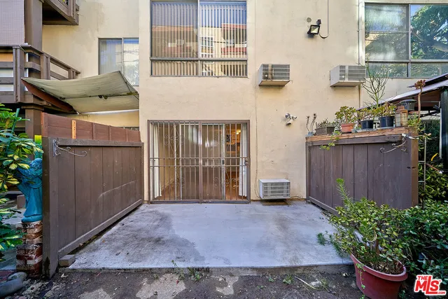 a view of a hallway with wooden floor and a hallway
