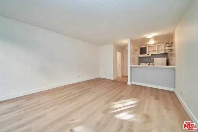a view of a kitchen with a sink and dishwasher