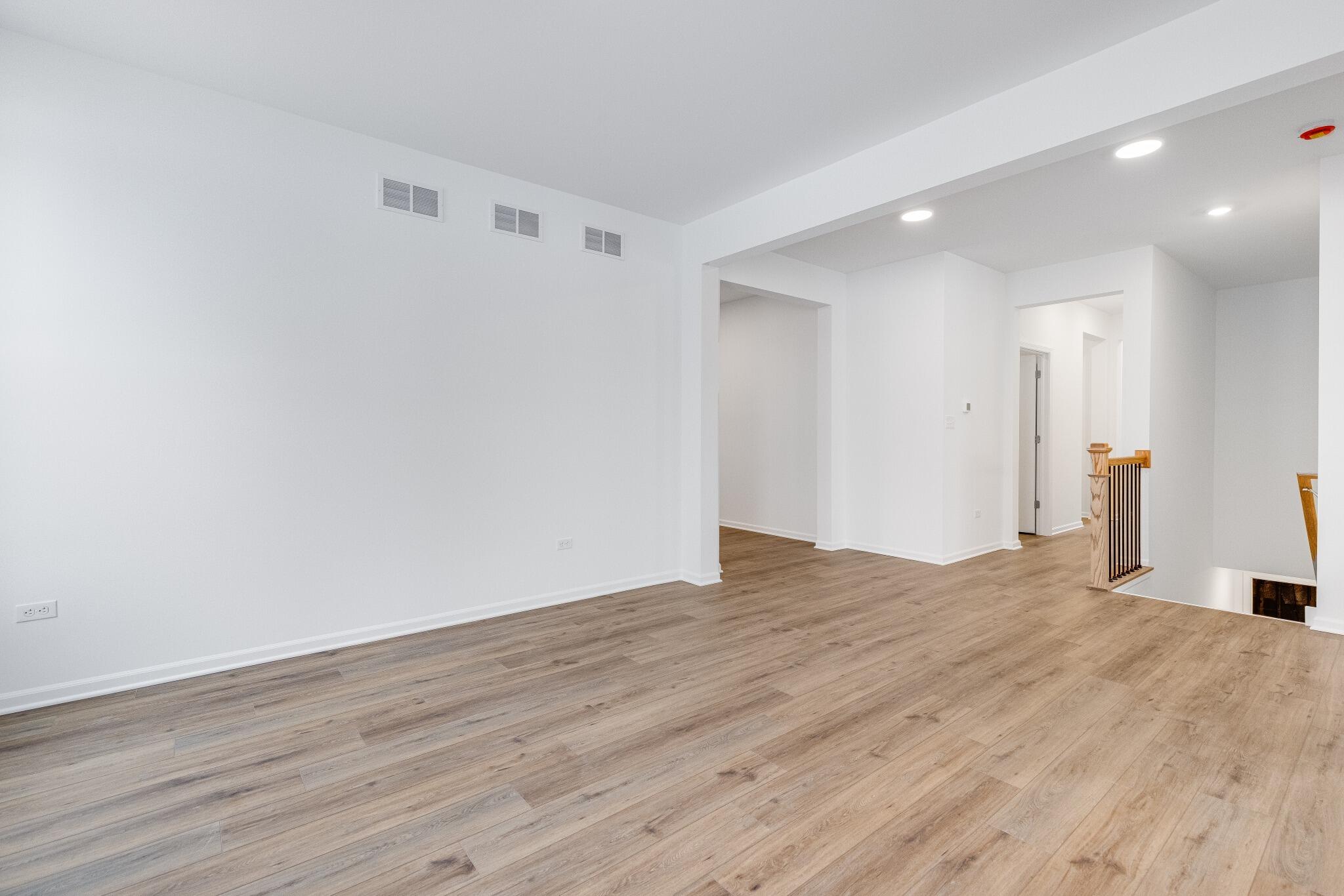 5948 East 112th Avenue Winfield, IN 46307 - Photo 11 of 36 a view of empty room with wooden floor