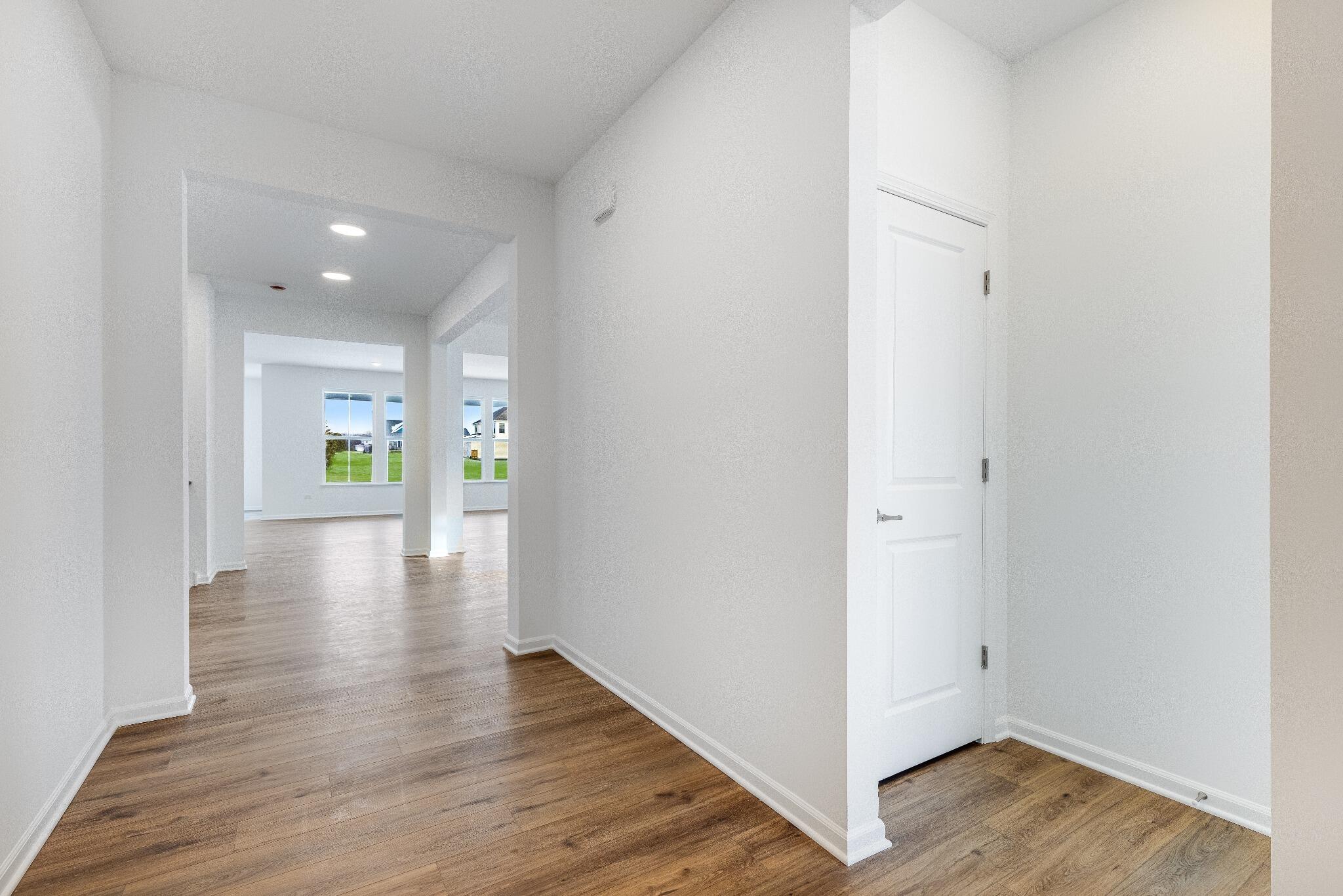 5948 East 112th Avenue Winfield, IN 46307 - Photo 4 of 36 a view of an entryway of a house and wooden floor