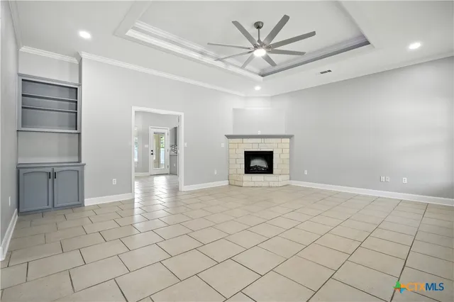 a view of an empty room with a fireplace