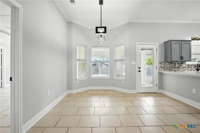 a kitchen with stainless steel appliances a refrigerator sink and cabinets