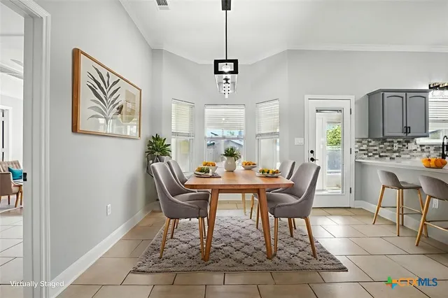 a view of a dining room with furniture