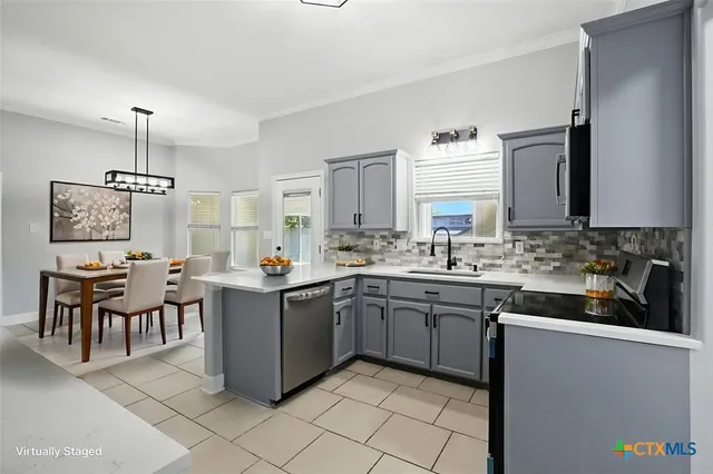 a kitchen with a sink and cabinets
