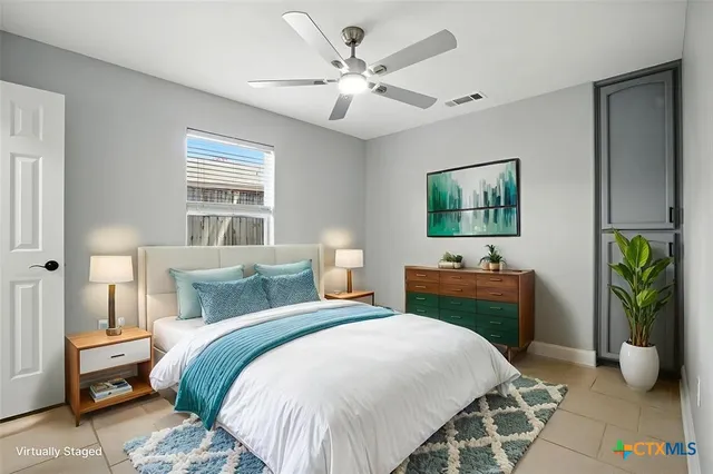 a view of a workspace with furniture and a potted plant