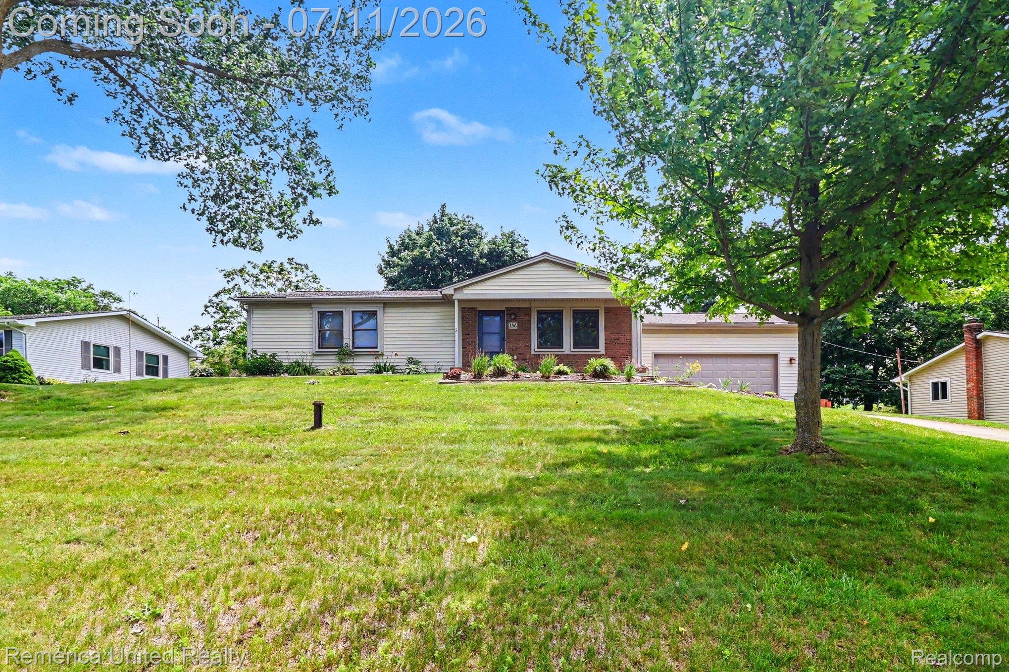 136 Endicott Howell, MI 48843 - Photo 2 of 28 Ranch-style exterior featuring a partial brick façade and siding