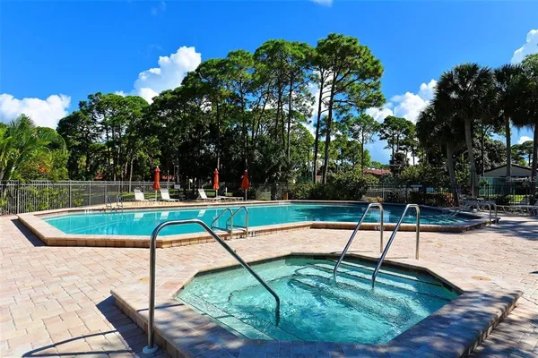a view of a swimming pool with a patio