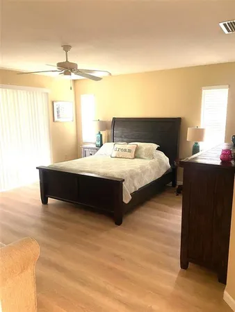 a bedroom with a bed and window