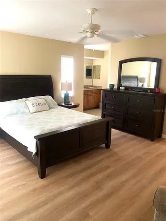 a bedroom with a bed and a dresser