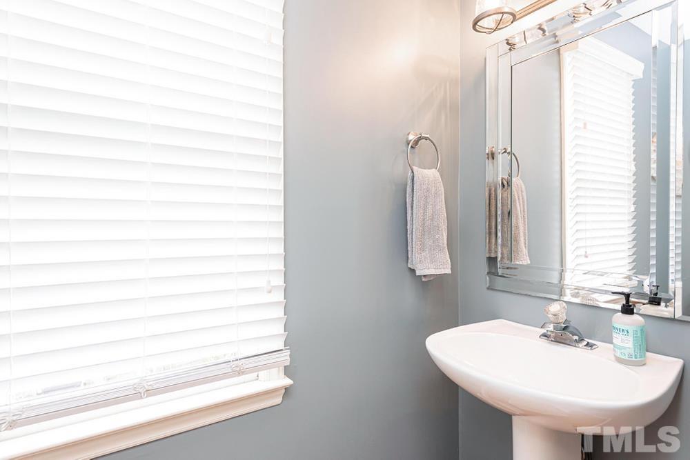 2316 Declaration Drive Raleigh, NC 27615 - Photo 14 of 30 a bathroom with a sink and a mirror