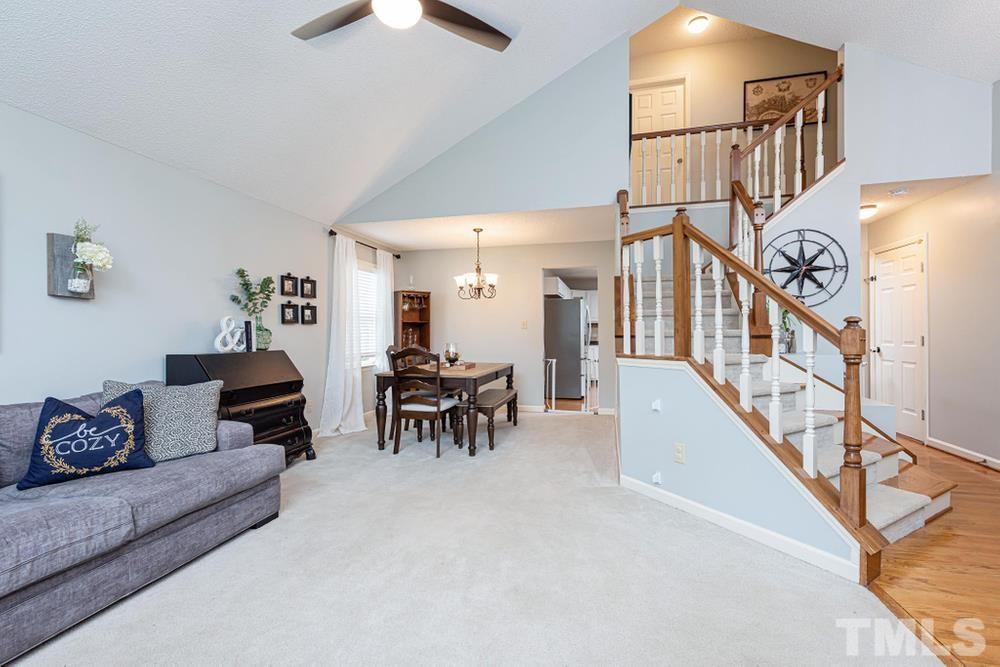 2316 Declaration Drive Raleigh, NC 27615 - Photo 3 of 30 a living room with furniture and a chandelier