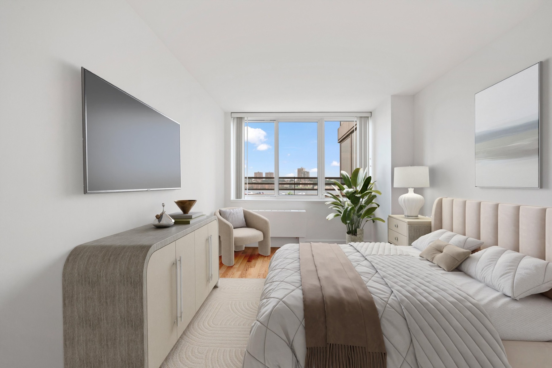 120 Riverside Boulevard, Unit 5H Manhattan, NY 10069 - Photo 5 of 17 a bedroom with a bed and a couch