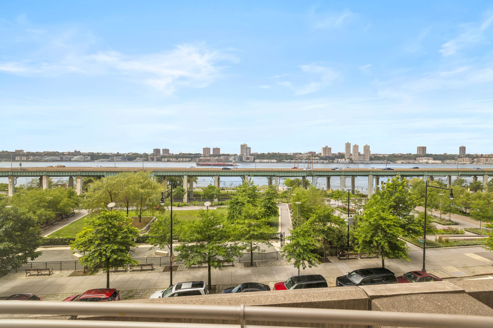 120 Riverside Boulevard, Unit 5H Manhattan, NY 10069 - Photo 9 of 17 a view of a city from a lake