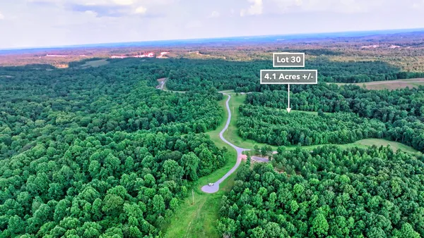 a wooden bench sitting in the middle of a yard