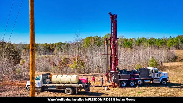 a sign that is on a brick wall