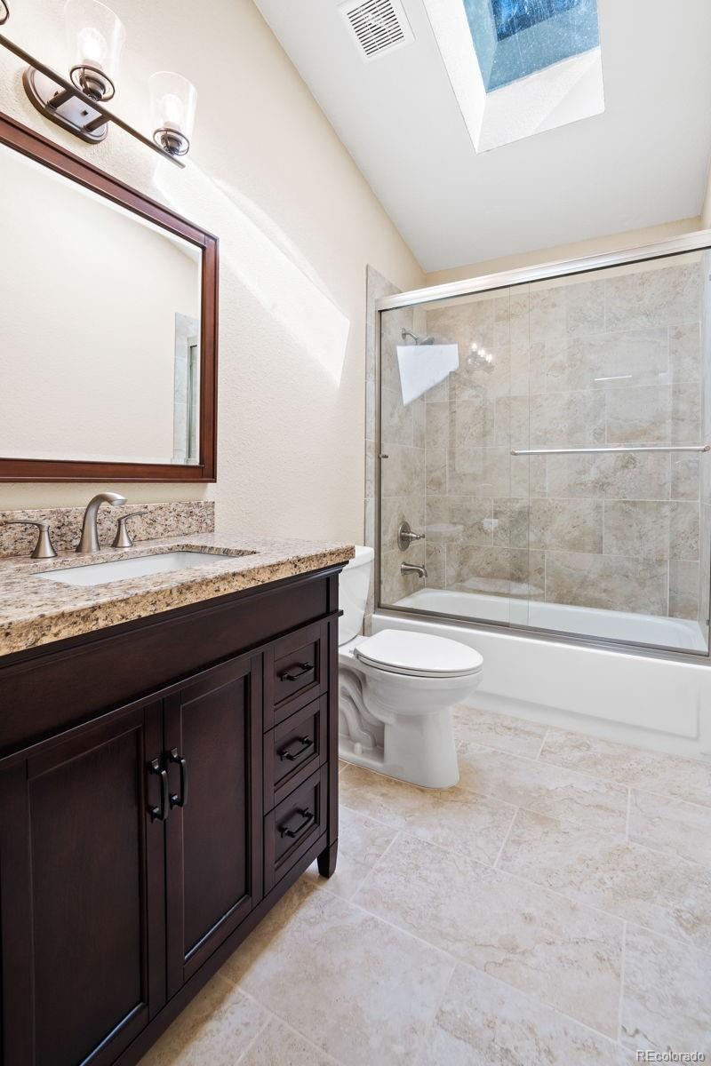 122 South Random Road Bailey, CO 80421 - Photo 13 of 38 a bathroom with a granite countertop sink toilet and shower