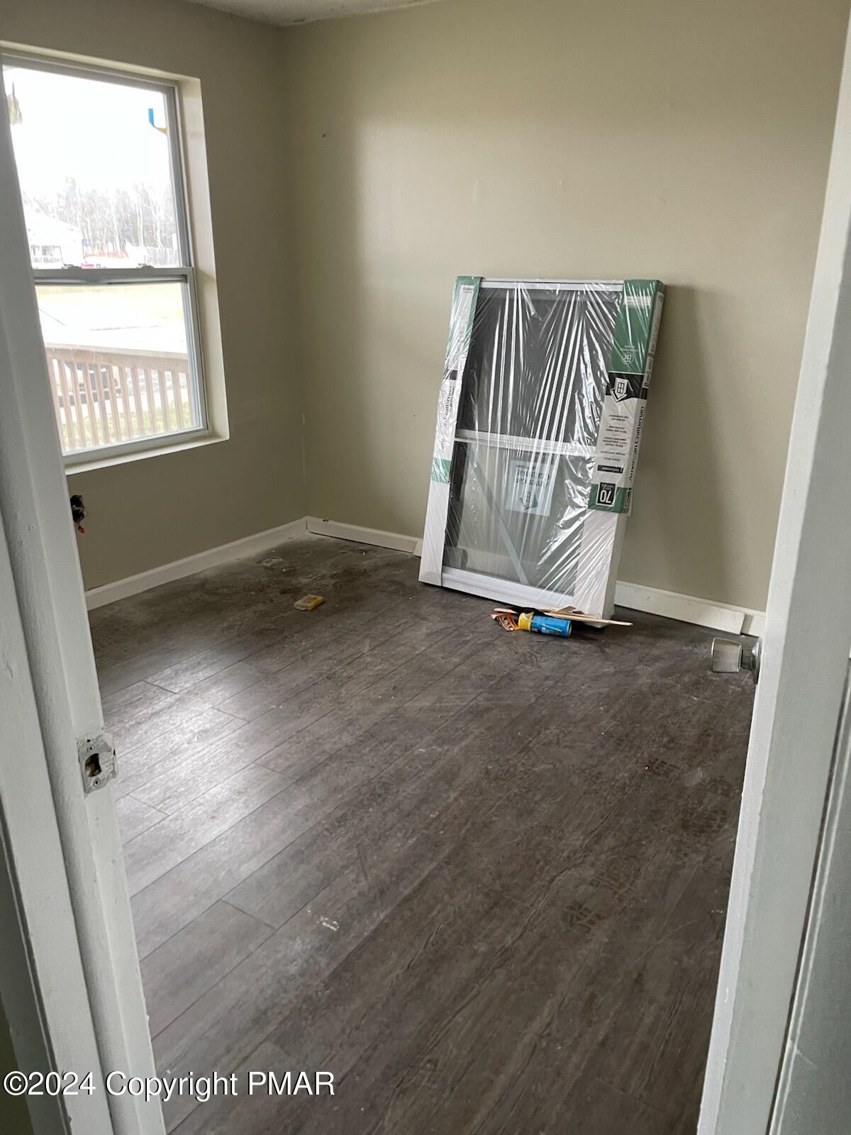 107 Snowshoe Court Mount Pocono, PA 18344 - Photo 3 of 3 an empty room with windows
