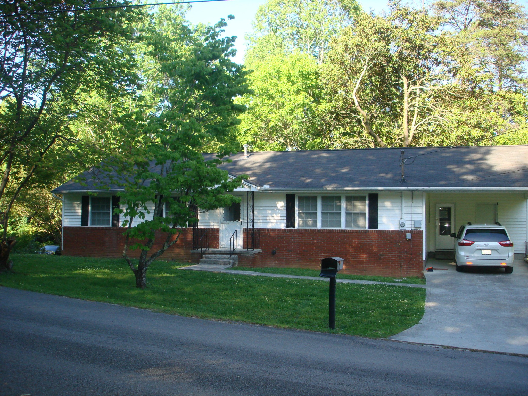225 Sherwood Road Powell, TN 37849 - Photo 17 of 17 a front view of a house with a garden
