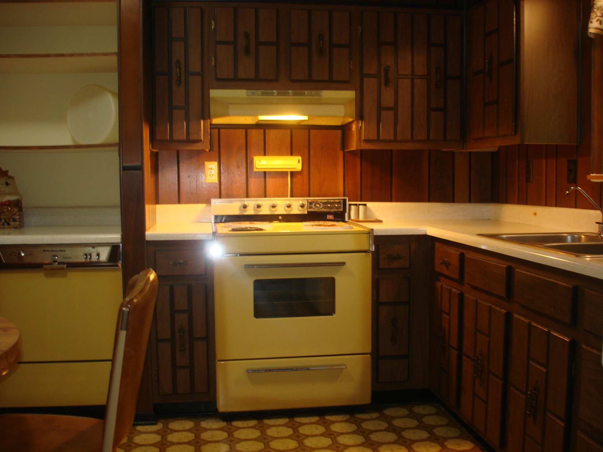 225 Sherwood Road Powell, TN 37849 - Photo 6 of 17 a kitchen with stainless steel appliances granite countertop a stove a sink and a refrigerator