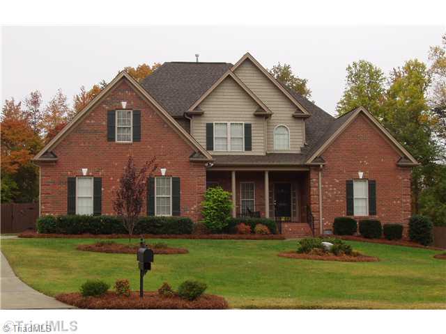 Exterior Front. All Brick home with Vinyl accents. Low maintenance. Cul-de-sac location. Fenced yard. Relaxing Front Porch. Oversized 2 Car Garage.