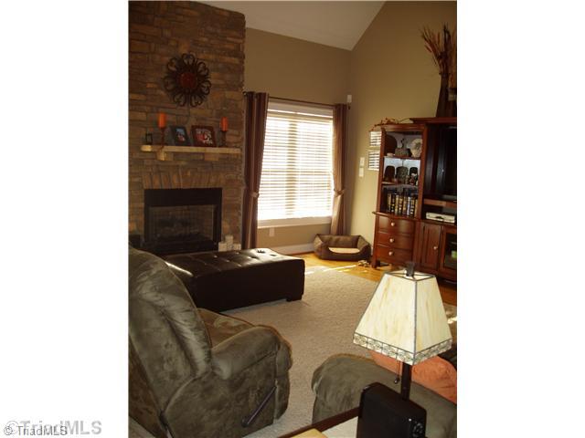 1700 Rita Court Oak Ridge, NC 27310 - Photo 3 of 16 Den/Family/Great Room. 2 Story Great room includes a cozy Fireplace with Gas Logs and Hardwood Floors. Open to Kitchen and Breakfast areas. Access to Deck for entertaining.