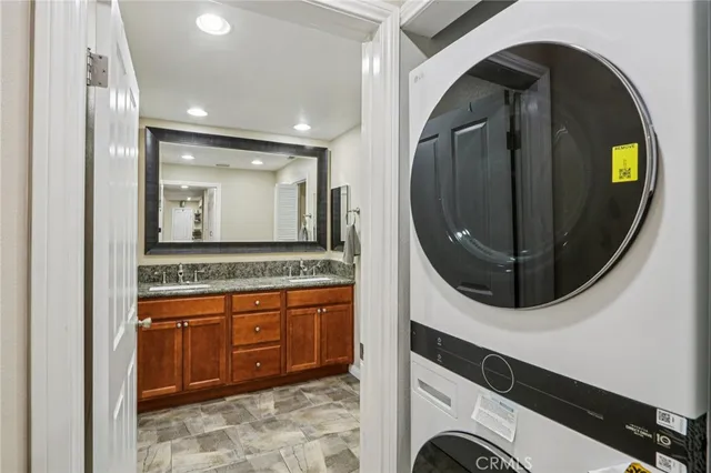a bathroom with a sink a mirror and a shower