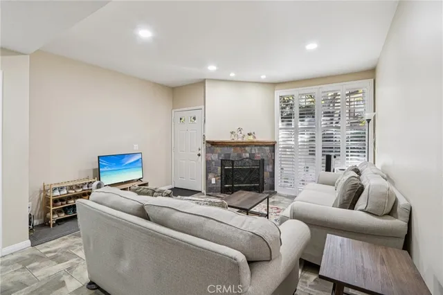 a living room with furniture and a fireplace