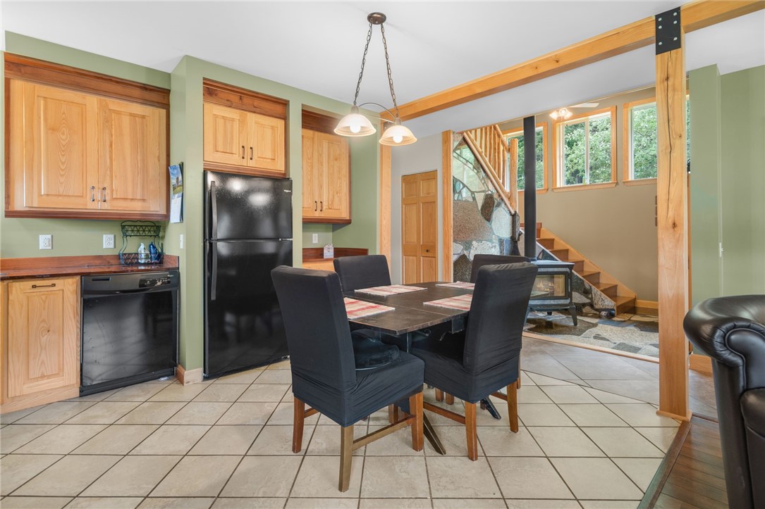 5903 Howell Road Locke, NY 13092 - Photo 11 of 31 An eat-in kitchen with custom cabinetry and striki