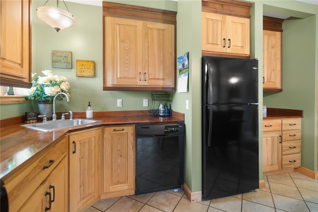 5903 Howell Road Locke, NY 13092 - Photo 12 of 31 Large eat-n kitchen with custom cabinetry and stri