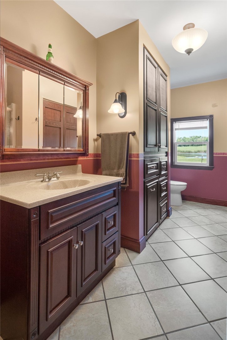 5903 Howell Road Locke, NY 13092 - Photo 14 of 31 First floor full bathroom with laundry