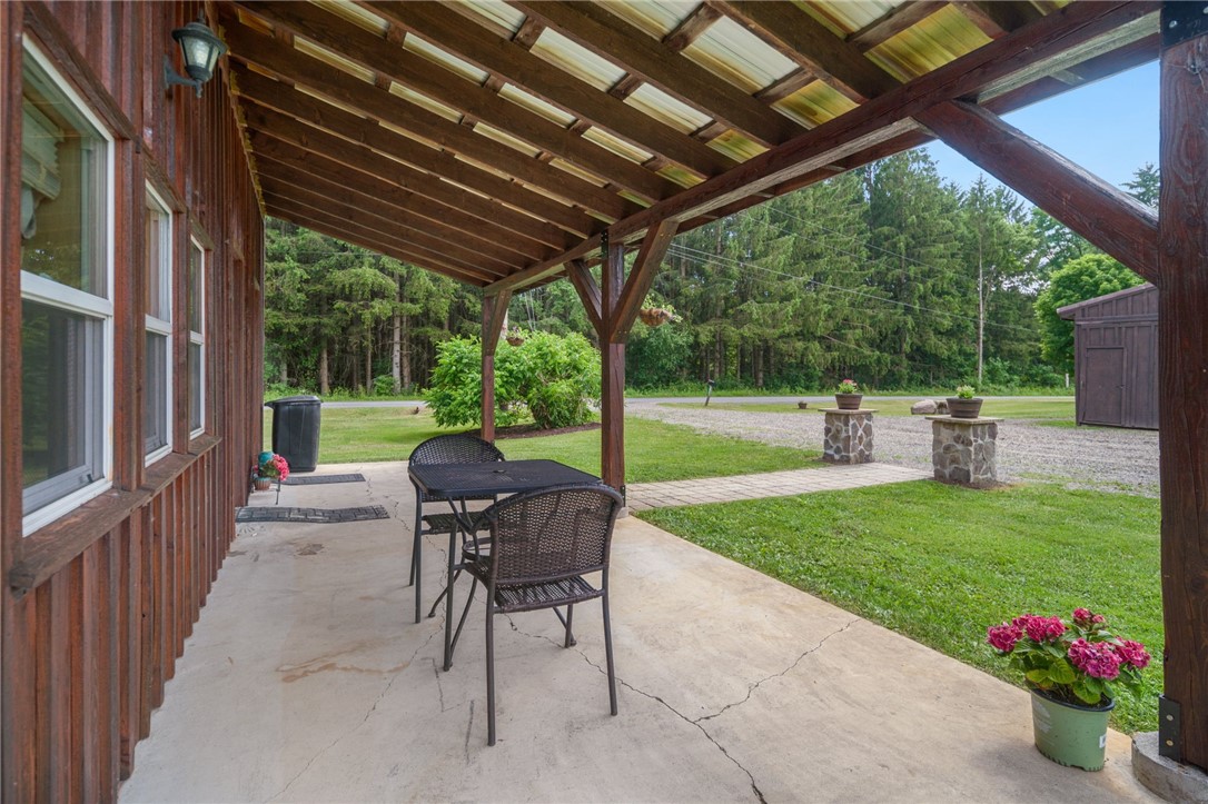 5903 Howell Road Locke, NY 13092 - Photo 2 of 31 Inviting front patio