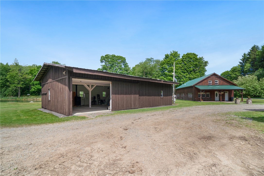5903 Howell Road Locke, NY 13092 - Photo 27 of 31 Heated 2+ car garage with wood shop