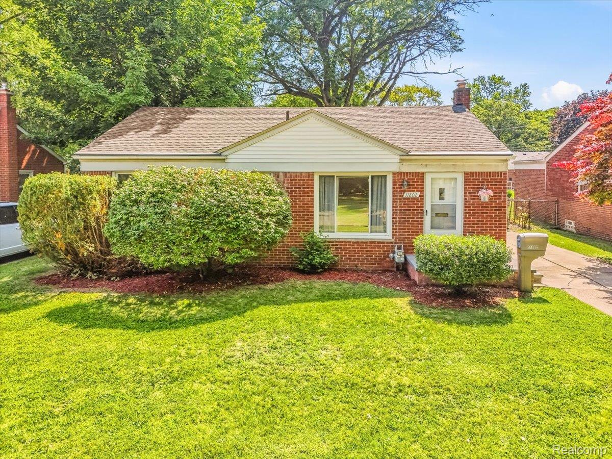 11802 Columbia Street Redford, MI 48239 - Photo 1 of 39 Red brick exterior with a New Front Porch and Storm Door.