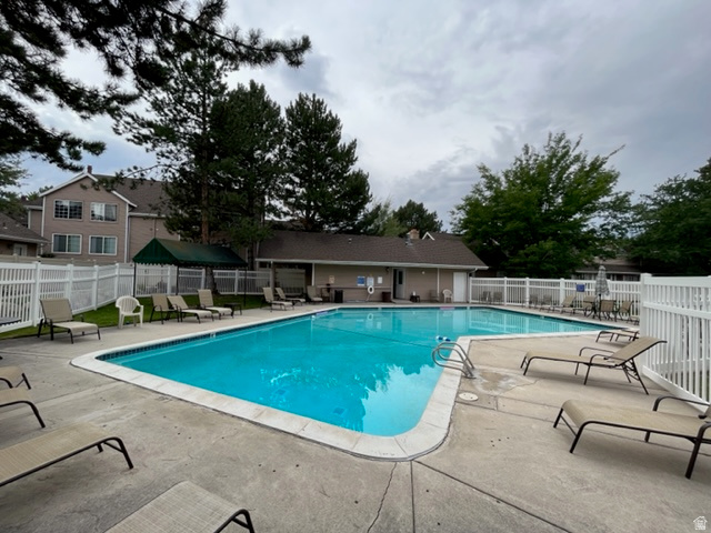 6884 670 East Midvale, UT 84047 - Photo 22 of 28 Community pool featuring a patio area