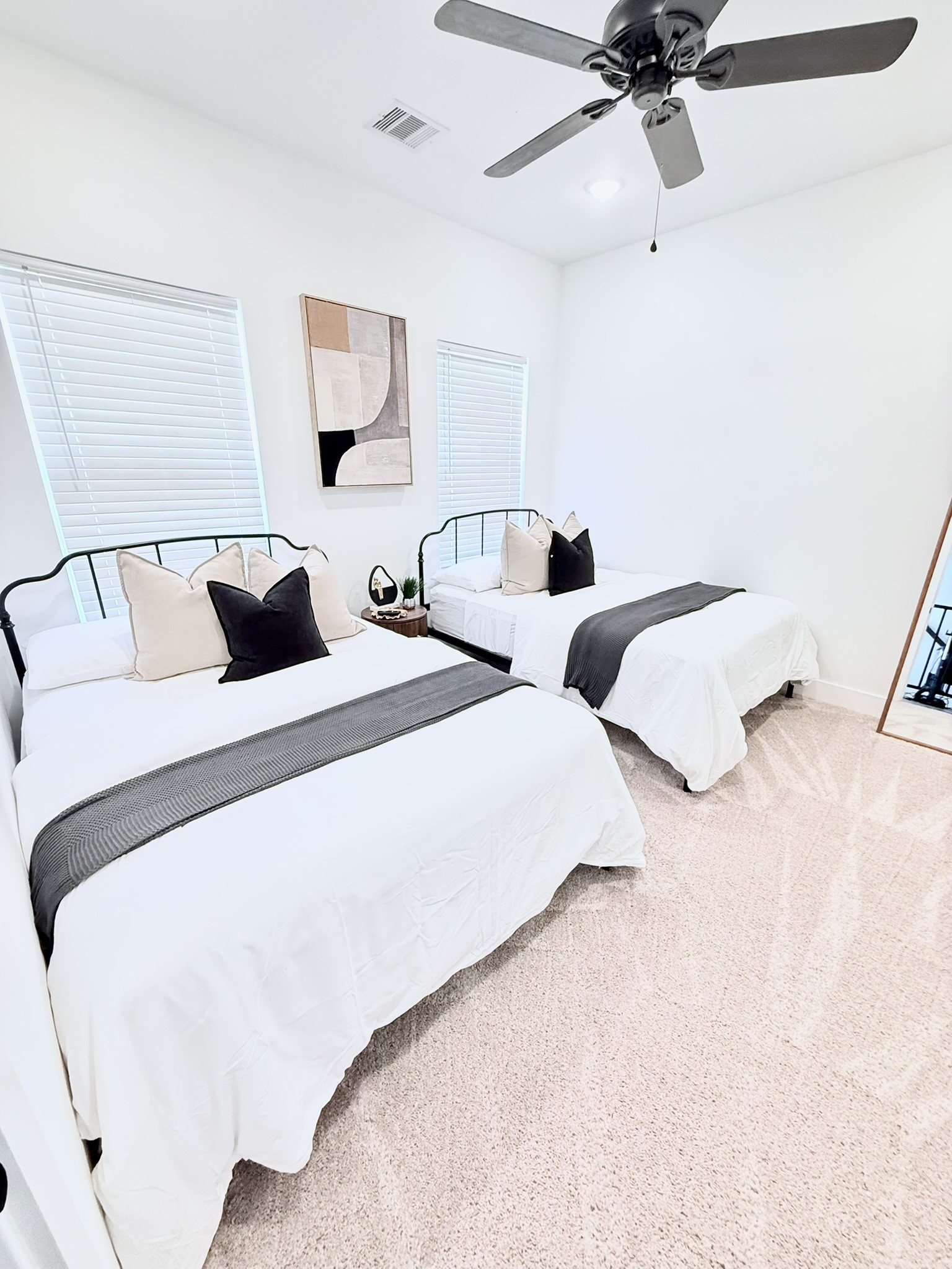 5527 Denmark Street, Unit B Houston, TX 77028 - Photo 3 of 40 a bedroom with a bed and a ceiling fan