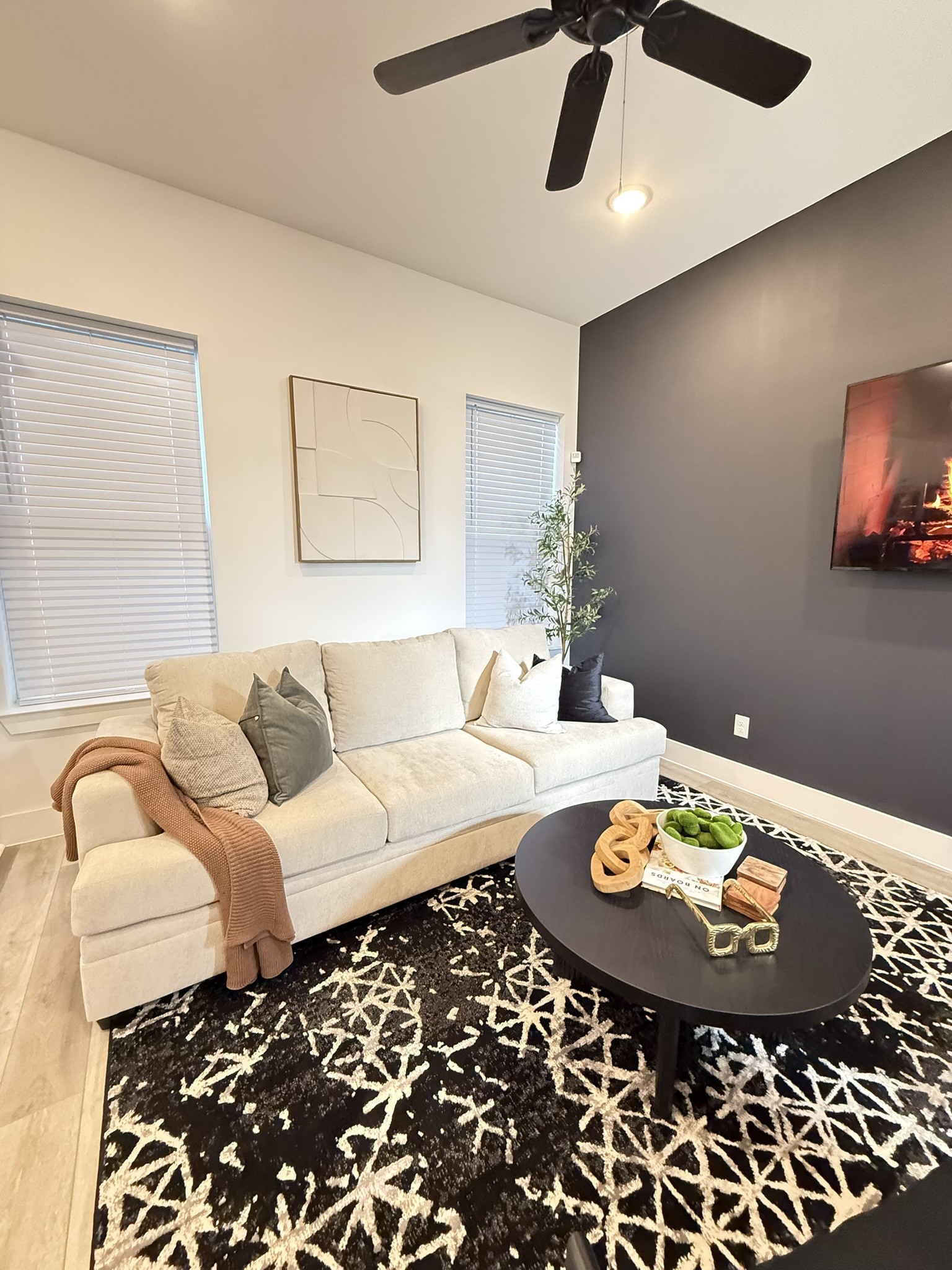 5527 Denmark Street, Unit B Houston, TX 77028 - Photo 32 of 40 a living room with furniture and a dining table with wooden floor
