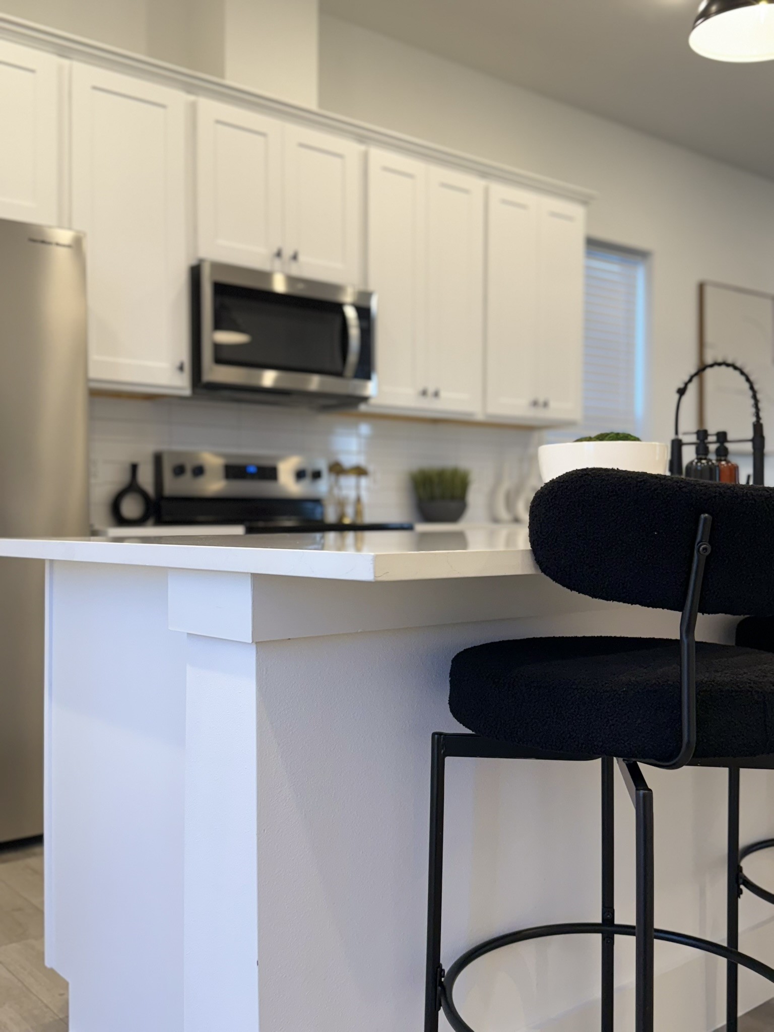 5527 Denmark Street, Unit B Houston, TX 77028 - Photo 40 of 40 a kitchen with stainless steel appliances a microwave a sink and cabinets