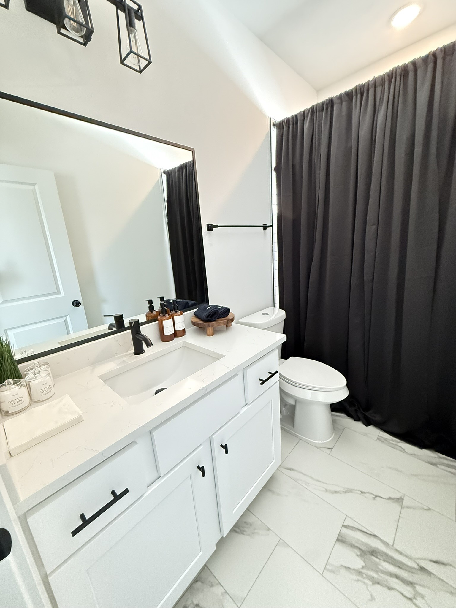 5527 Denmark Street, Unit B Houston, TX 77028 - Photo 7 of 40 a bathroom with a sink and a mirror