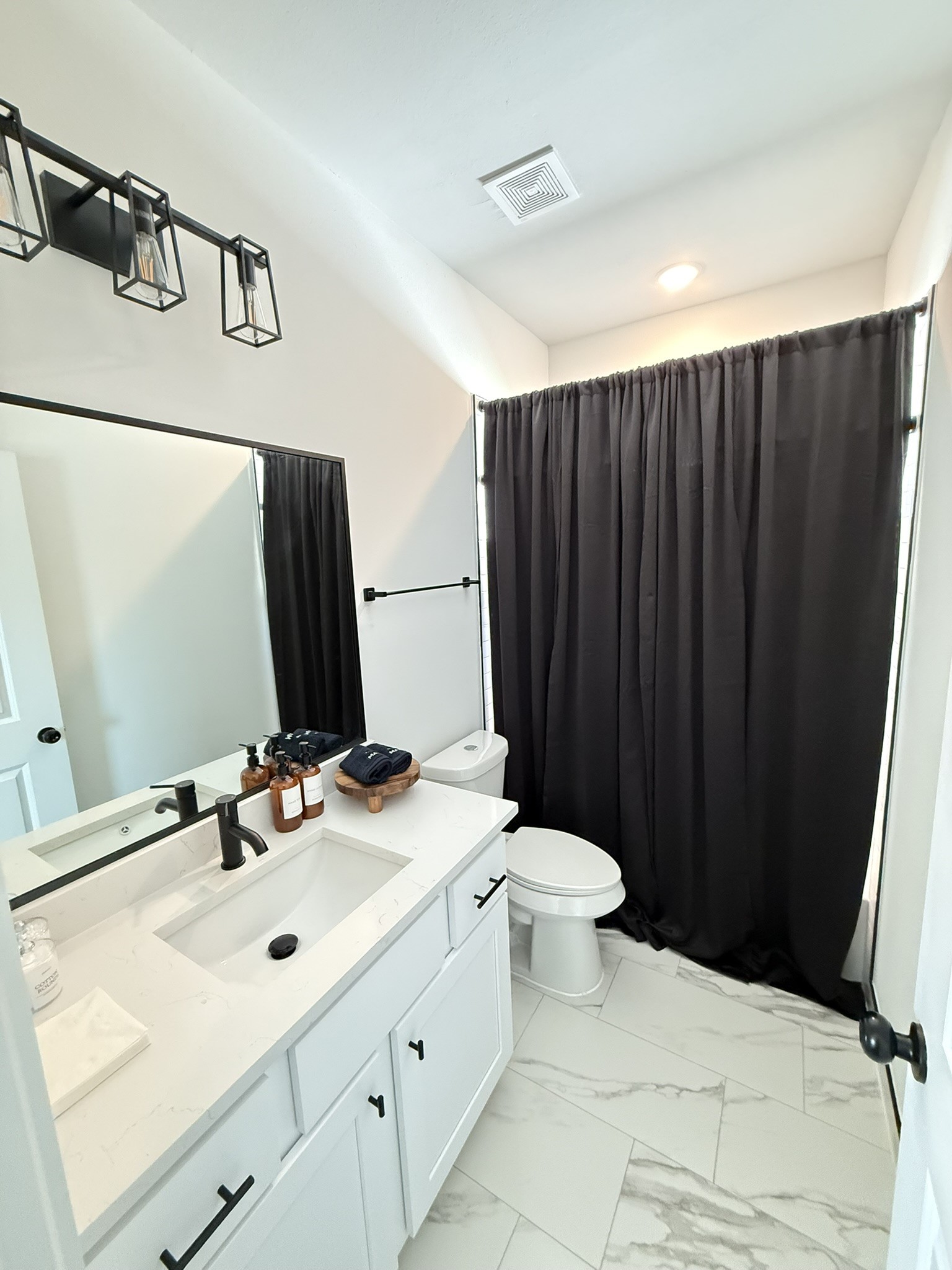 5527 Denmark Street, Unit B Houston, TX 77028 - Photo 8 of 40 a bathroom with a sink and a mirror