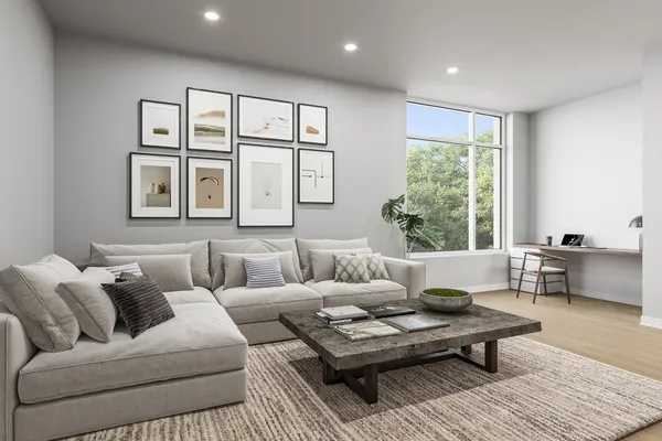 a living room with furniture and windows
