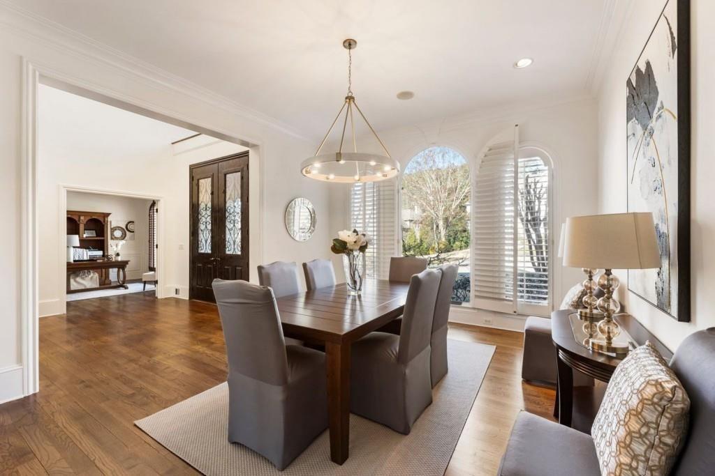 2250 Blackheath Trace Alpharetta, GA 30005 - Photo 13 of 51 a dining room with furniture a chandelier and wooden floor